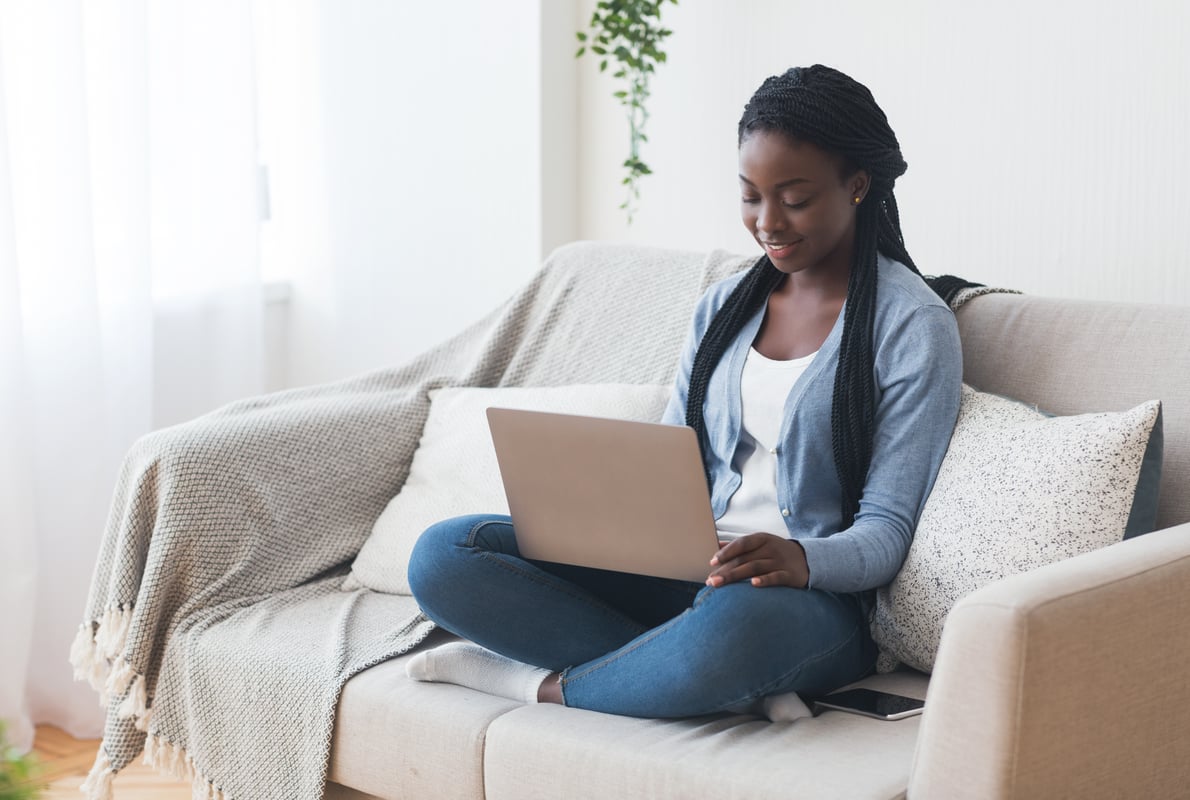 A woman using her laptop for a remote lesson