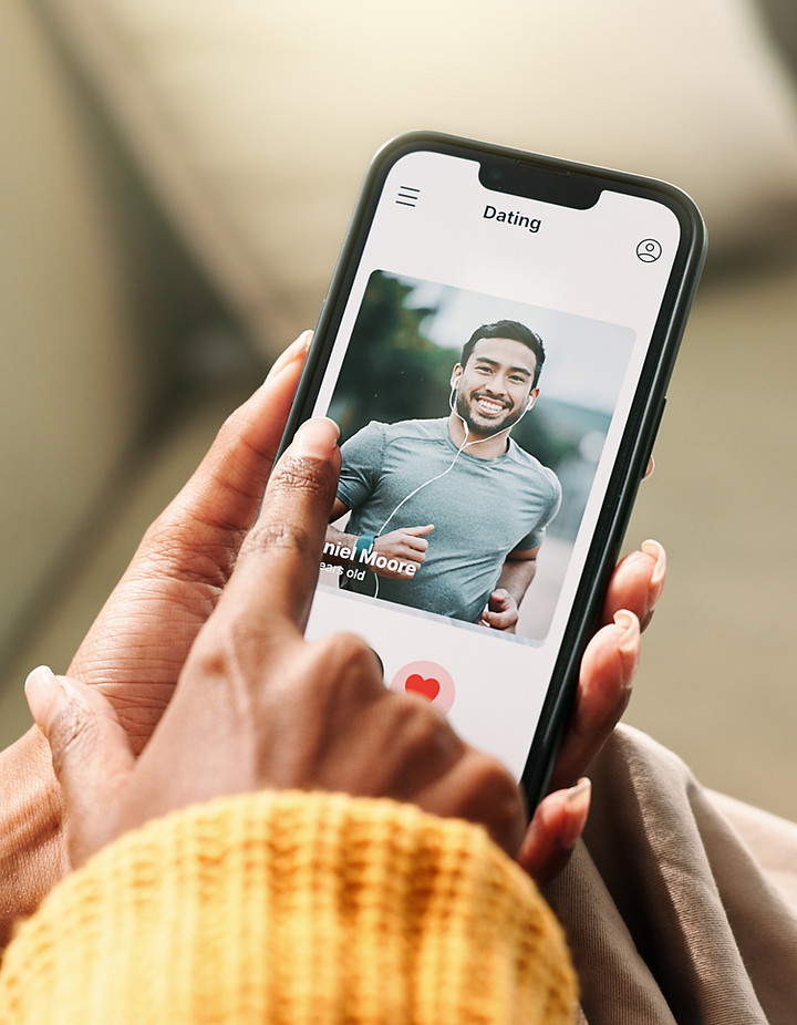 Dating profile photo displayed on a phone